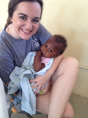 Katie holding babies outside Hope Center Clinic